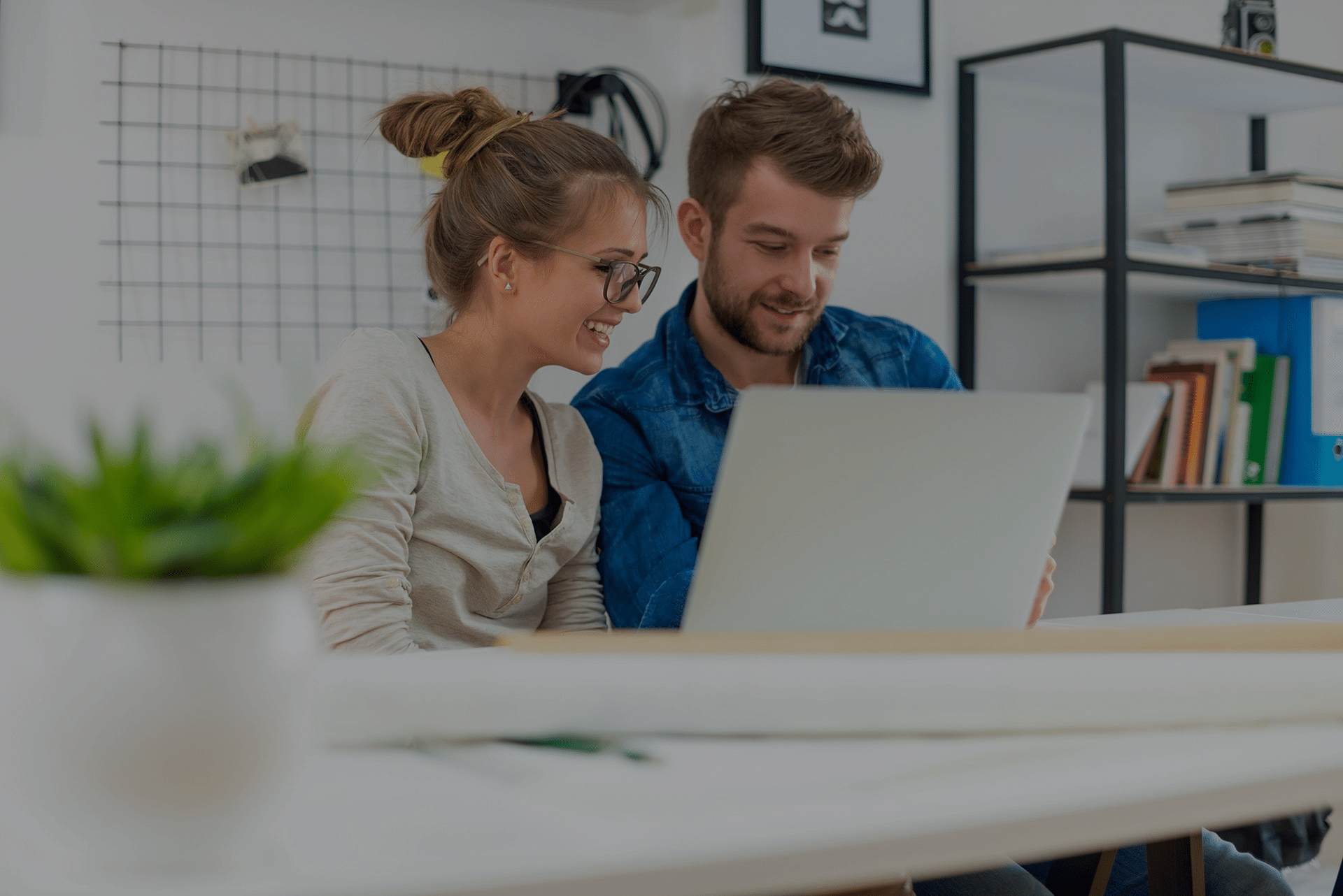 woman and man on a laptop